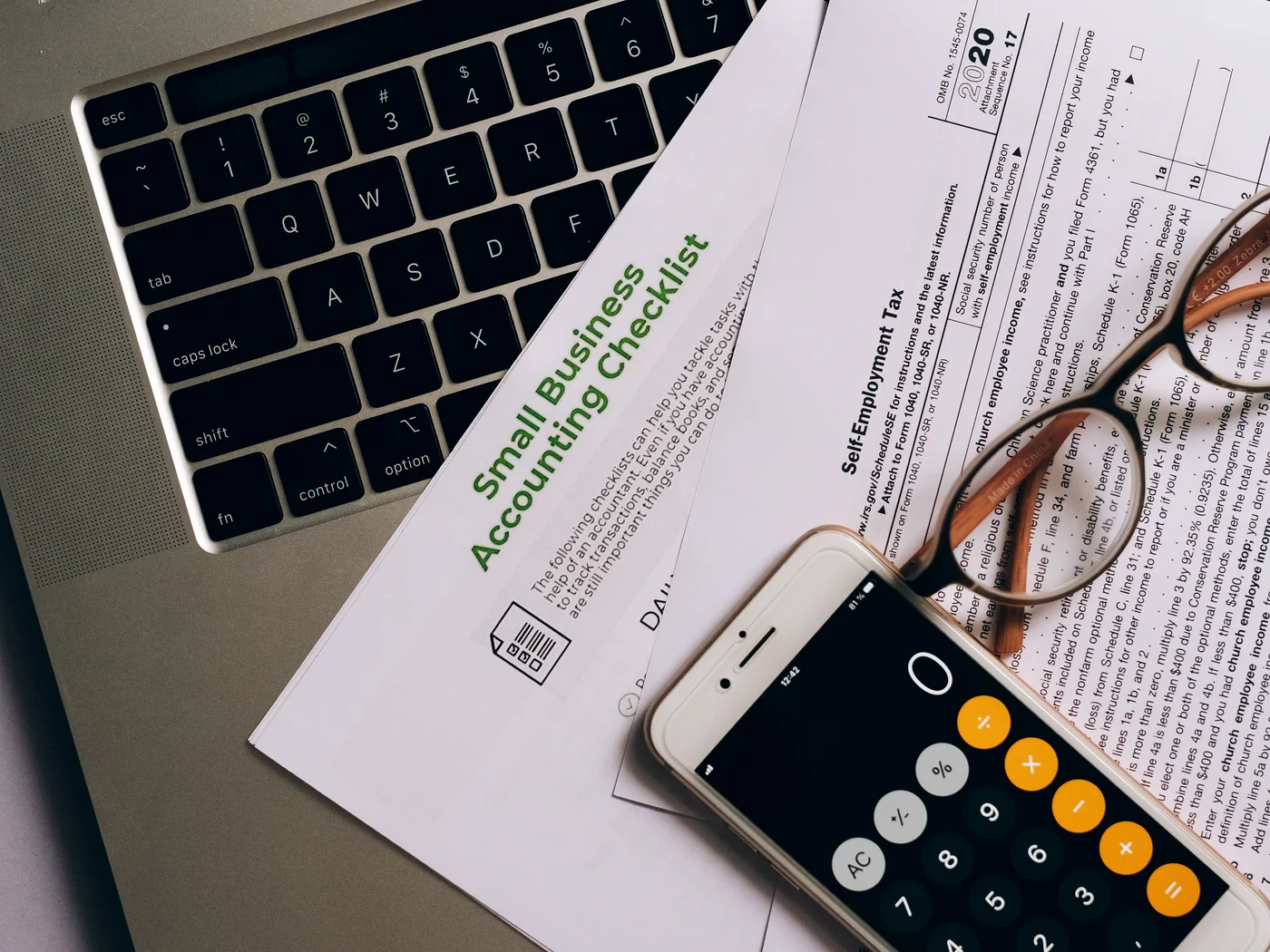 Business records and laptop representing a business bank statement mortgage review
