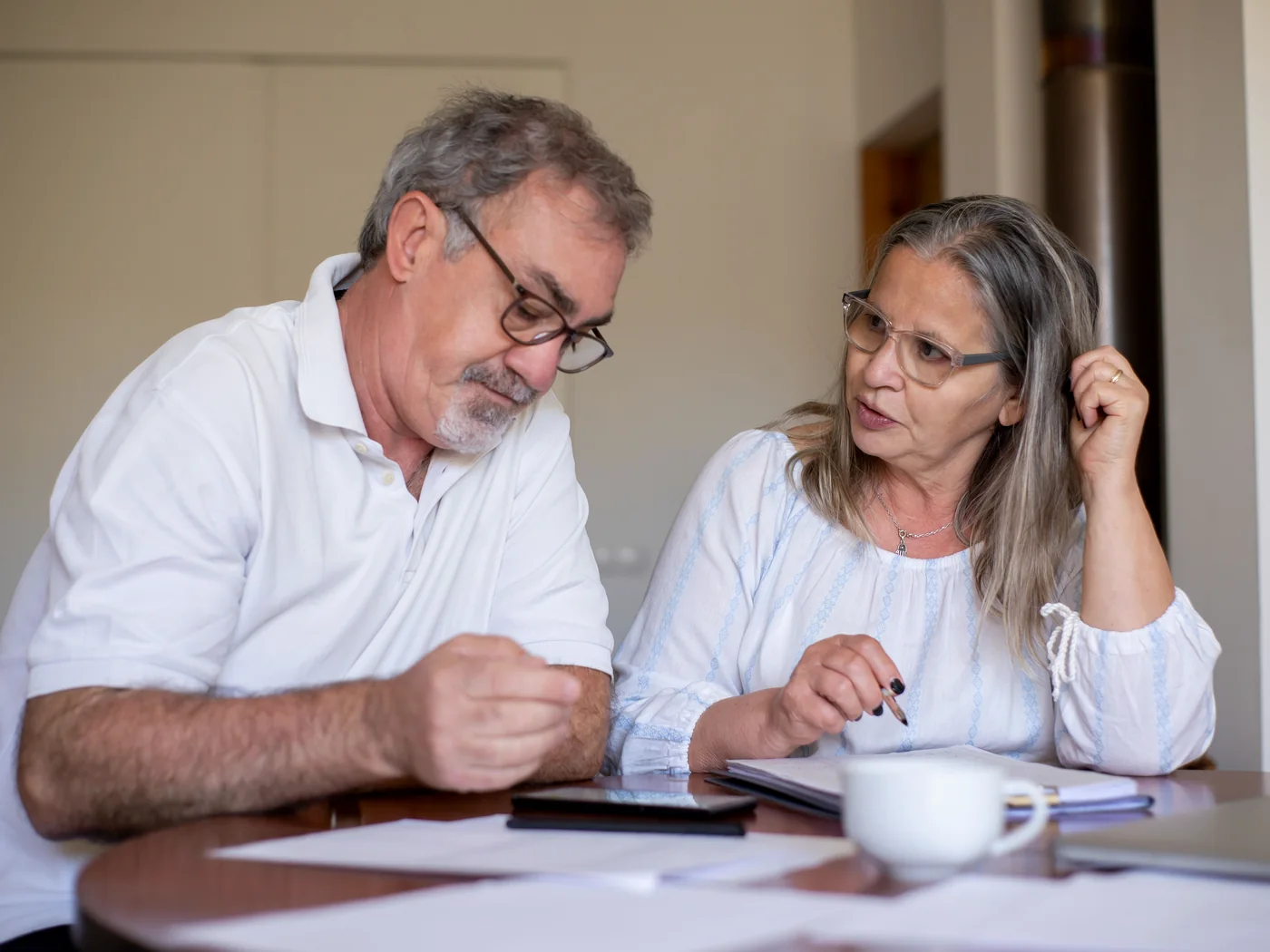 Borrowers reviewing financial documents and available assets