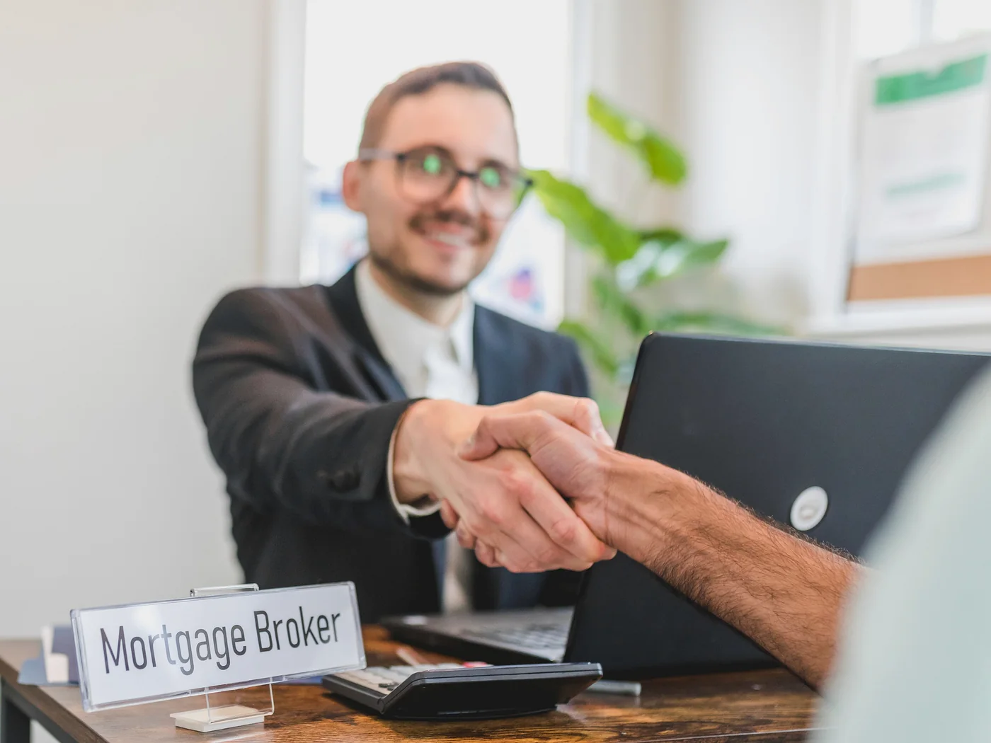 Mortgage professional and borrower completing a second mortgage review